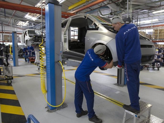 Employees work on the automobile assembly line of Bluecar electric city cars at Renault car maker factory in Dieppe, western France, September 1, 2015. In June 2015, French carmaker Renault started the production of the Bollore Bluecar, stepping up its electric vehicle cooperation with French conglomerate Bollore. Picture taken September 1, 2015. REUTERS/Philippe Wojazer
