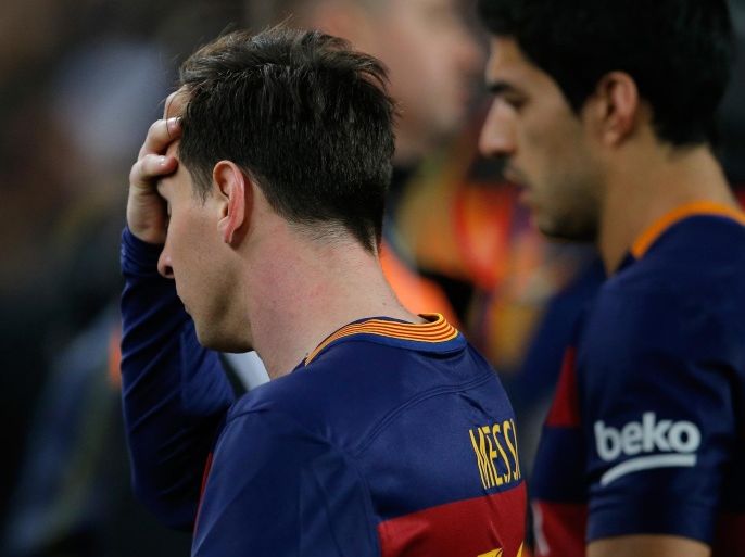 Barcelona's Lionel Messi and Luis Suarez, right, leave the pitch at the end of a Spanish La Liga soccer match between Barcelona and Real Madrid, dubbed 'el clasico', at the Camp Nou stadium in Barcelona, Spain, Saturday, April 2, 2016. Real Madrid won 2-1. (AP Photo/Manu Fernandez)