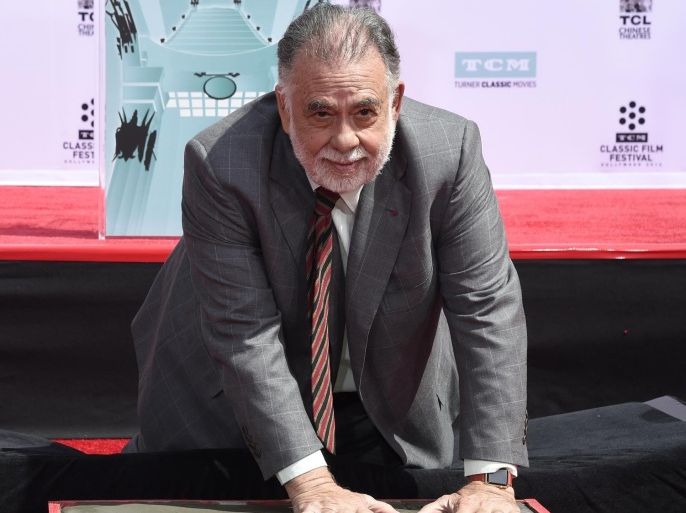Francis Ford Coppola places his hands in cement during a handprint and footprint ceremony at the TCL Chinese Theater on Friday, April 29, 2016, in Los Angeles. (Photo by Chris Pizzello/Invision/AP)