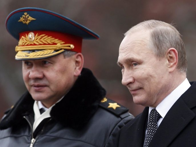 Russian President Vladimir Putin (R) and Russian Defense Minister Sergey Shoygu (L) attend a wreath-laying ceremony at the tomb of the unknown soldier, near the Kremlin during the national celebrations of the 'Defender of the Fatherland Day' in Moscow, Russia, 23 February 2016. Defender of the Fatherland Day is observed in most of Russia and former Soviet republics to commemorate the people serving in the Russian Armed Forces.