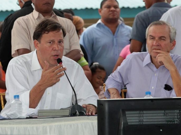 A handout photograph provided by the Presidency of Panama on 02 July 2014 shows new president of Panama, Juan Carlos Varela (L), next to minister of Presidency, Alvaro Aleman (R), speaking during his first cabinet council in Panama City, Panama, 02 July 2014. Valera and his administration have approved measures for 100 percent potable water, oportunities for youngs to oppose crime and more assitance for older people and students. EPA/Presidency of Panama