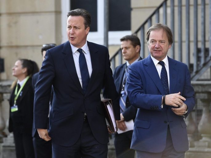 British Prime Minister David Cameron (L) is being greeted by Hugo Swire (R), British Minister of State at the Foreign and Commonwealth Office, as he arrives to the Anti-Corruption Summit in Lancaster House in London, Britain, 12 May 2016. The Summit comes after the publication in April 2016 of the so-called Panama Papers leak on offshore tax havens and the people involved.