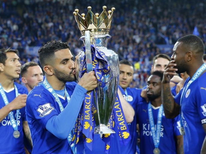Britain Soccer Football - Leicester City v Everton - Barclays Premier League - King Power Stadium - 7/5/16 Leicester City's Riyad Mahrez celebrates winning the premier league as he kisses the trophy Reuters / Darren Staples Livepic EDITORIAL USE ONLY. No use with unauthorized audio, video, data, fixture lists, club/league logos or "live" services. Online in-match use limited to 45 images, no video emulation. No use in betting, games or single club/league/player publications. Please contact your account representative for further details.