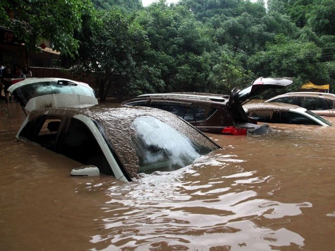 Automobiles are flooded after heavy rainfall in Guilin, Guangxi Zhuang Autonomous Region, China, May 8, 2016. REUTERS/Stringer ATTENTION EDITORS - THIS IMAGE WAS PROVIDED BY A THIRD PARTY. EDITORIAL USE ONLY. CHINA OUT.