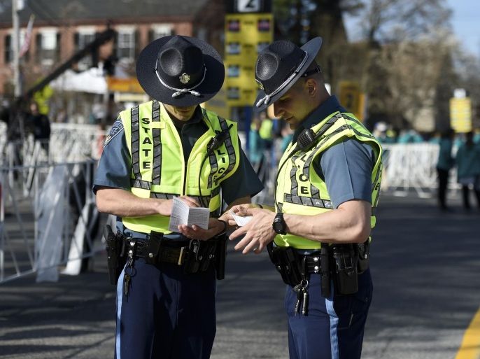 Apr 18, 2016; Boston, MA, USA; Massachusetts State Police check their notes at the start line prior to the start of the Boston Marathon in Hopkington MA. Mandatory Credit: Bob DeChiara-USA TODAY Sports
