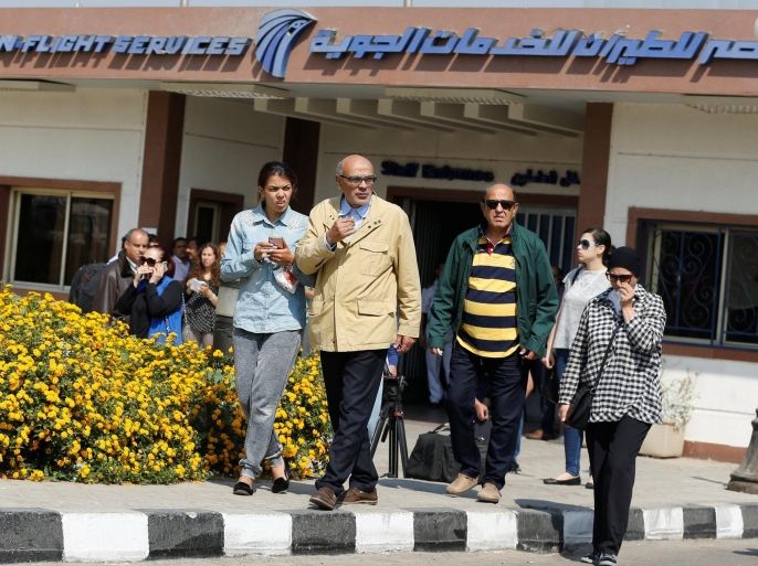 Unidentified relatives and friends of passengers who were flying in an EgyptAir plane that vanished from radar en route from Paris to Cairo react as they wait outside the Egyptair in-flight service building where relatives are being held at Cairo International Airport, Egypt May 19, 2016.      REUTERS/Amr Abdallah Dalsh