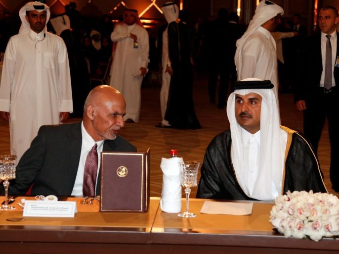 Qatar's Emir Sheikh Tamim Bin Hamad Al-Thani (R) and Afghanistan's President Ashraf Ghani attend Doha Forum in Doha, Qatar May 21, 2016. REUTERS/Stringer FOR EDITORIAL USE ONLY. NO RESALES. NO ARCHIVES.