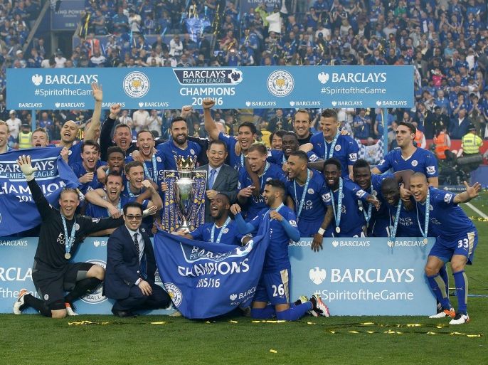 Britain Soccer Football - Leicester City v Everton - Barclays Premier League - King Power Stadium - 7/5/16 Leicester City celebrate with the trophy after winning the Barclays Premier League Action Images via Reuters / John Clifton Livepic EDITORIAL USE ONLY. No use with unauthorized audio, video, data, fixture lists, club/league logos or "live" services. Online in-match use limited to 45 images, no video emulation. No use in betting, games or single club/league/player publications. Please contact your account representative for further details.