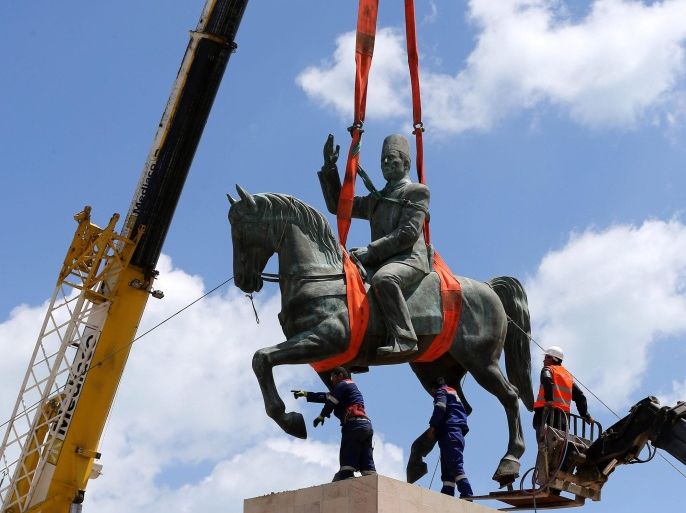 Tunisian workers remove the statue of first Tunisian president, Habib Bourguiba, from La Goulette in the northern outskirts of Tunis, Tunisia, 03 May 2016. The statue will be returned to its original location in the center of Tunis on 01 June as part of the celebrations to mark the 61st anniversary of BourguibaÃ¢â¬â¢s return from exile. The statue of Bourguiba was moved to La Goulette in 1987 following a coupe by the former president Zine El Abidine Ben Ali.