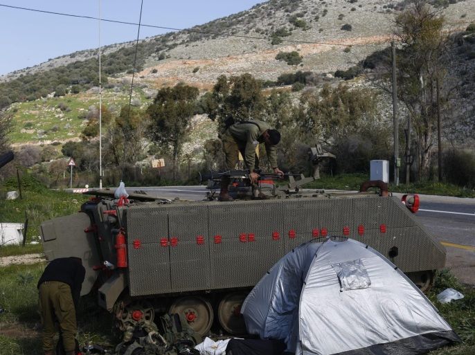 Israeli soldiers puts his submachine gun on top of his APC (Armored personnel carrier) next to the blocked road leading to the Israeli Alawi village of Ghajar, near Har Dov area, on the Israeli-Lebanese border, 29 January 2015. Two Israeli soldiers and a Spanish UN peacekeeper were killed a day earlier in the deadliest exchange of fire between Israel and Lebanon's Hezbollah militia since a 2006 war. The fighting comes 10 days after an alleged Israeli airstrike targeted