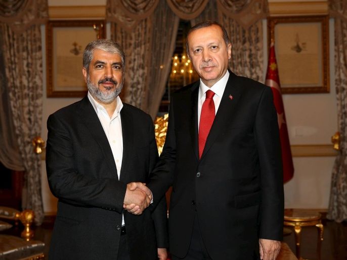 Turkish President Tayyip Erdogan (R) meets with Hamas leader Khaled Meshaal in Istanbul, Turkey, December 19, 2015 in this handout photo provided by the Presidential Palace. Erdogan met with Meshaal, leader of the Palestinian militant group Hamas, on Saturday in Istanbul, Turkish presidential sources said, a day after Israel and Turkey said they were close to patching up a five-year political rift. A source from Erdogan's office said Meshaal "briefed Erdogan on the lat