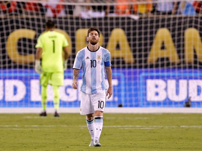 Jun 26, 2016; East Rutherford, NJ, USA; Argentina midfielder Lionel Messi (10) reacts after missing a shot during the shoot out round against Chile in the championship match of the 2016 Copa America Centenario soccer tournament at MetLife Stadium. Chile won. Mandatory Credit: Adam Hunger-USA TODAY Sports
