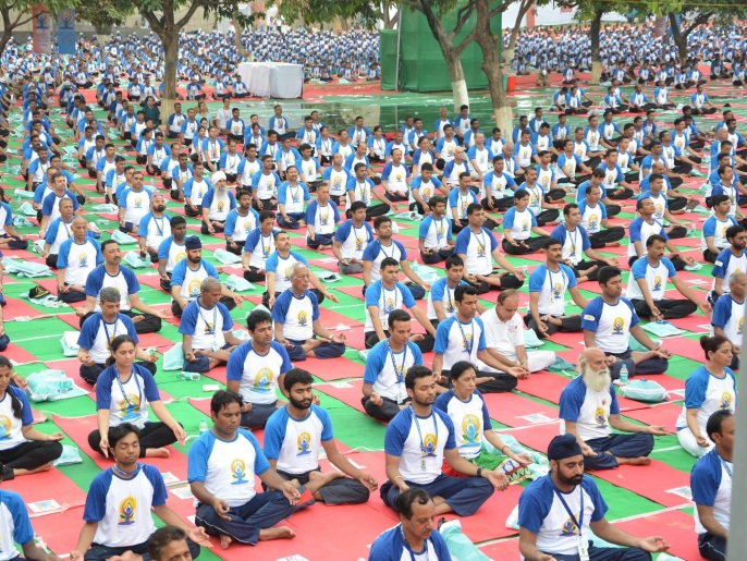A general view shows Yoga enthusiasts performing Yoga in the mass yoga demonstration in the presence of Indian Prime Minister, Narendra Modi (unseen) at the Capitol Complex on the occasion of the second International Day of Yoga in Chandigarh, India, 21 June 2016. The UN has declared 21 June as the International Yoga Day after adopting a resolution proposed by Indian Prime Minister Narendra Modi's government.