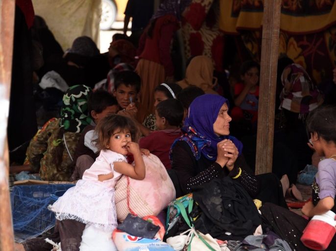 A handout photograph made available on 22 June 2016 by the humanitarian organization, Norwegian Refugee Council (NRC) showing displaced Iraqis from Fallujah stranded in Amariyat Al Fallujah, just before the Bzeibiz Bridge, waiting to be allowed into Baghdad, Iraq, 18 June 2016. According to UN High Commissioner for Refugees (UNHCR) Iraqis fled their homes in Fallujah city due the ongoing fighting between the Iraqi forces and Islamic State (IS) militants. EPA/KARL SCHEM