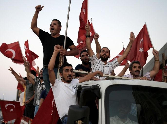 Supporters of Turkish President Tayyip Erdogan shout slogans on the back of a truck during a pro-government demonstration on Taksim square in Istanbul, Turkey, July 16, 2016. REUTERS/Alkis Konstantinidis