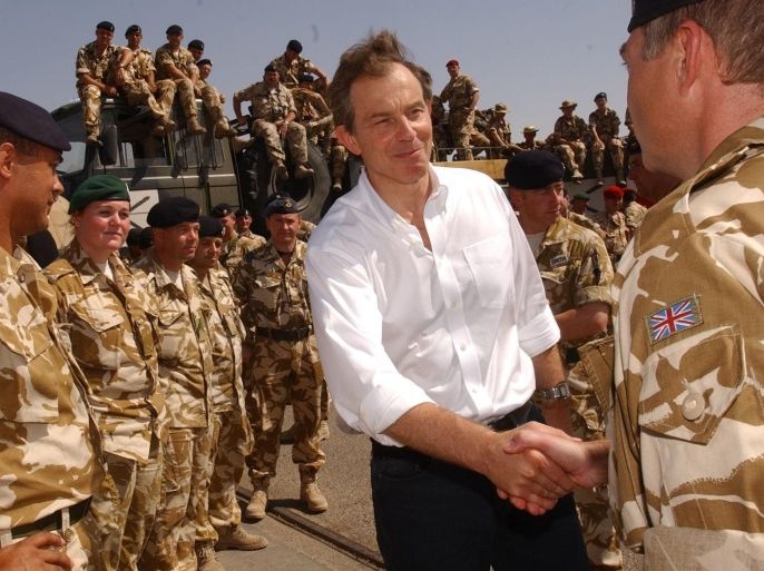 Britain's Prime Minister Tony Blair meets British troops in the port of Umm Qasr southern Iraq, May 29, 2003. Picture taken May 29, 2003. REUTERS/POOL/Stefan Rousseau/File Photo