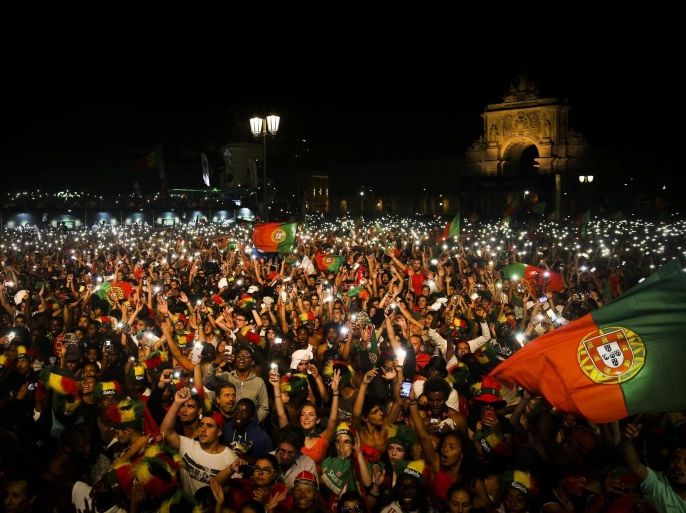 Supporters of Portugal celebrate their team's victory at the end of the public viewing of the UEFA EURO 2016 final match between Portugal and France at Terreiro do Paco in Lisbon, Portugal, 10 July 2016. Portugal won 1-0.