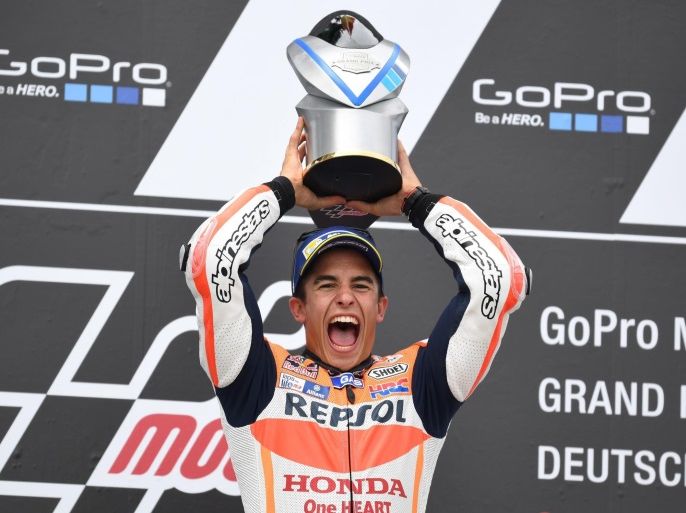 Spanish MotoGP rider Marc Marquez from Repsol Honda team celebrates on the podium after winning the Motorcycle World Championship Grand Prix Germany at the Sachsenring in Hohenstein-Ernstthal, Germany, 17 July 2016.