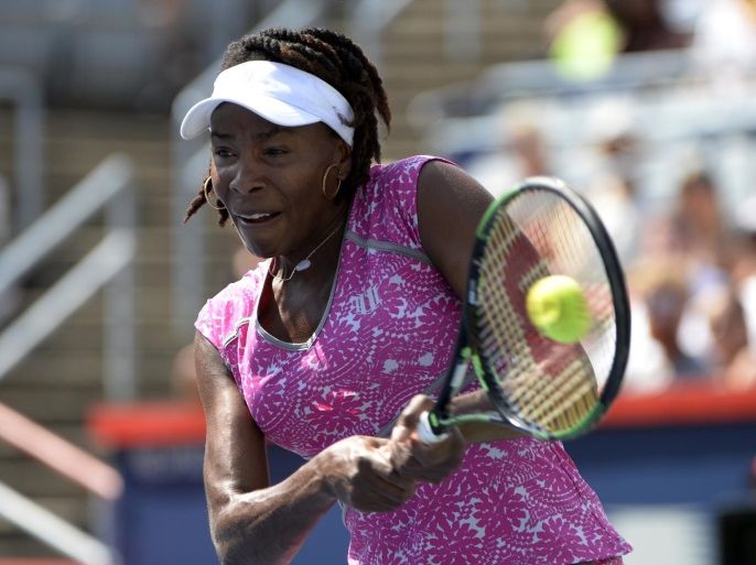 Jul 27, 2016; Montreal, Quebec, Canada; Venus Williams of the United States hits a backhand against Barbora Strycova of the Czech Republic (not pictured) on day three of the Rogers Cup tennis tournament at Uniprix Stadium. Mandatory Credit: Eric Bolte-USA TODAY Sports