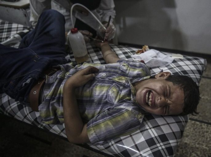 A Syrian boy screams in pain as he receives first aid in a field hospital following airstrikes by forces loyal to the Syrian government in the rebel-held area of Douma, on the outskirts of the capital Damascus, Syria, 09 July 2016.