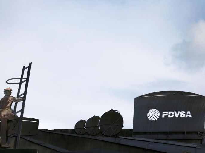 The logo of the Venezuelan oil company PDVSA and cut-outs depicting oil facilities are seen on a building of the company in Caracas, Venezuela July 21, 2016. Picture taken July 21, 2016. To match Special Report VENEZUELA-PDVSA/CONTRACT REUTERS/Carlos Garcia Rawlins