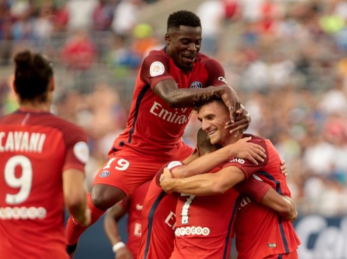 Paris Saint-Germain player Serge Aurier (C) congratulates Thomas Meunier (R) after he scored a goal against Real Madrid during the International Champions Cup match between Real Madrid and Paris Saint-Germain at the Ohio Stadium in Columbus, Ohio, USA, 27 July 2016.