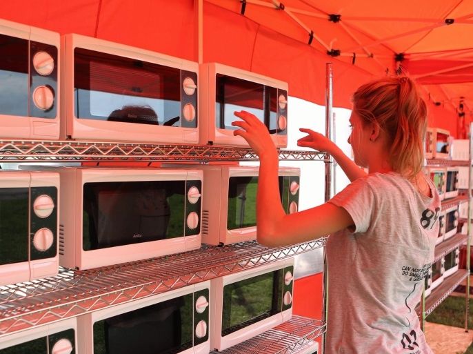 Microwave ovens prepared for the pilgrims particpating in the World Youth Day 2016 events are seen at the Vistulan Boulevards in Krakow, Poland, 25 July 2016. The World Youth Day in Poland is held in and around Krakow from 26 to 31 July. EPA/STANISLAW ROZPEDZIK POLAND OUT