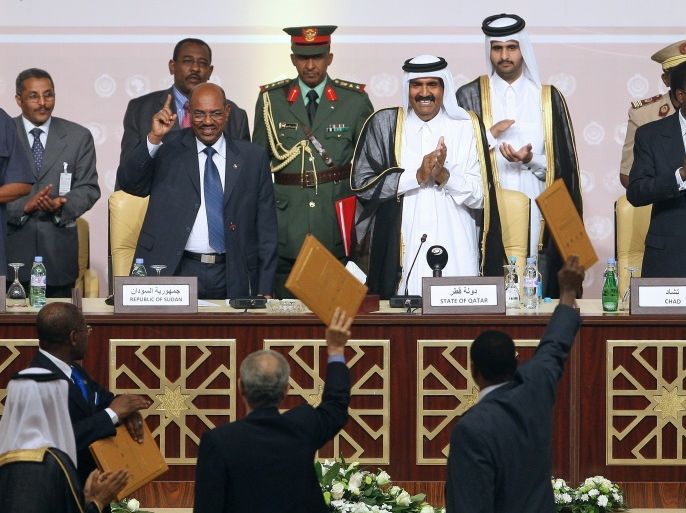 pa02824117 From L-R at the top; President Isaias Afworki of Eritrea, Sudan's President Omar Hassan al-Bashir ,Qatar Emir Sheikh Hamad bin Khalifa al-Thani and President Idriss Deby of Chad react they are being shown the peace accord by Sudan's Presidential Adviser Ghazi Salah Al-Deen Al-Attabani (bottom, C) and Liberation Movement and Justice (LJM) representative Al-Tijani Al-Sisi (bottom, R) after the signing ceremony of a peace accord with Darfur rebel group Liberation Movement and Justice (LJM) in Doha Sheraton Hotel, Doha-Qatar on 14 July 2011. Ending eight years of fighting between government troops and the rebel group, the agreement provides for power-sharing, repatriation of the displaced inhabitants, and allocates undisclosed funds for development in the province, according to sources close to