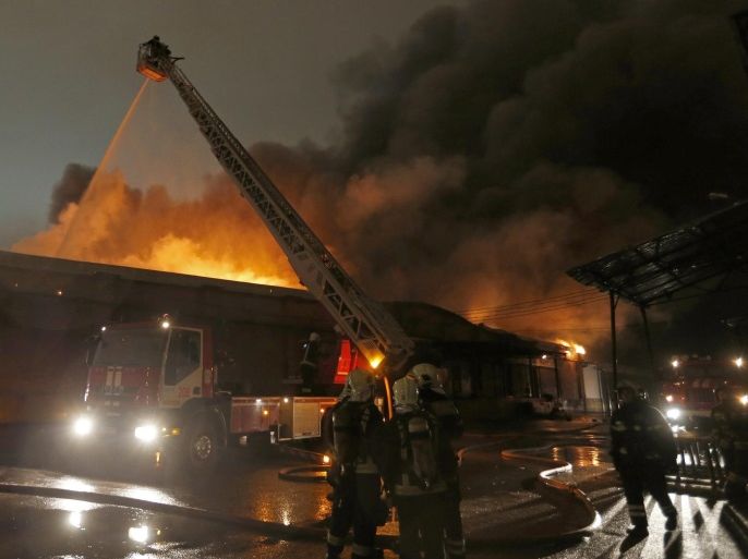 Russian fire fighters attempt to extinguish a fire at a workshop, producing plastic dinnerware in Moscow, Russia, 22 September 2016. Reports say that at least five fire fighters have died.
