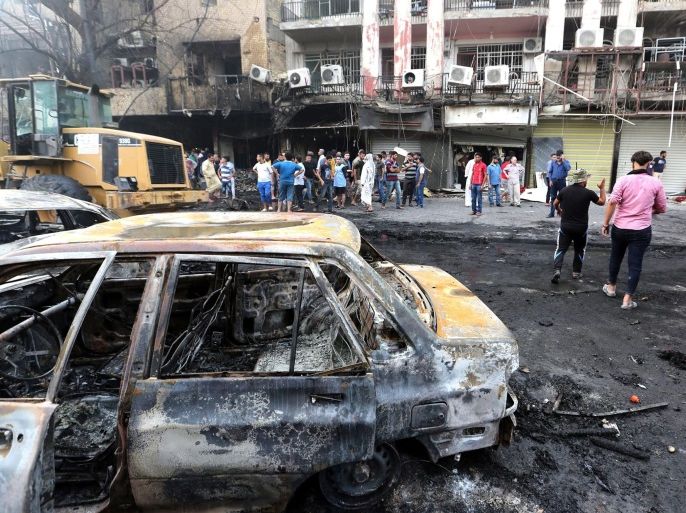 Iraqis gather at the site of suicide car bomb attack in the Karada district of central Baghdad, Iraq, 03 July 2016. At least 23 people were killed and 70 others were wounded in a suicide car bomb attack targeted Karada district of Baghdad and other attack by a roadside bomb in Shaab market , Iraqi police said.