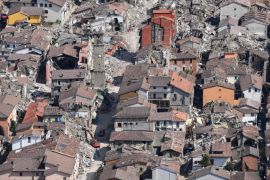 A picture made available on 02 September 2016 shows an aerial view taken from a Fire Brigades helicopter of damaged houses in Amatrice, Italy, 01 September 2016. Rescue teams continue their operations in the rubble of the largely destroyed Lazio mountain village in the central Italy. A devastating 6.0 magnitude earthquake early morning of 24 August left a total of 293 dead, according to official sources.