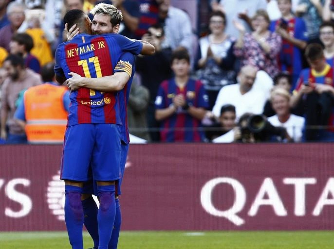 FC Barcelona's Argentine forward Leo Messi (R) celebrates with Neymar jr. their 4-0 lead against Deportivo La Coruna during their Spanish Primera Division League's soccer match at the Camp Nou stadium in Barcelona, northeastern Spain, 15 October 2016.