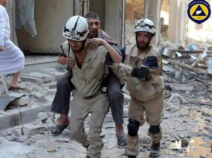 An undated handout picture made available by the Syria Civil Defence volunteer organization on 07 October 2016 showing a volunteer carrying an injured man in Aleppo, Syria. Syria Civil Defence is a volunteer group, also known as the White Helmets, that consists of over three thousand local volunteers spread across areas of conflict around Syria. In the past three years they saved over 62 thousand Syrian lives, while losing 145 volunteer during airstrikes and 430 others injured. EPA/SYRIA CIVIL DEFENCE / HANDOUT