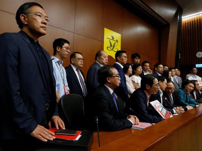 Pro-Beijing lawmakers meet journalists after staging a walk-out to stall legislator-elects Baggio Leung and Yau Wai-ching from swearing in at the Legislative Council in Hong Kong, China October 19, 2016. REUTERS/Bobby Yip