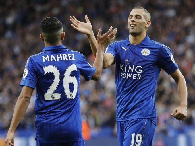 Football Soccer Britain - Leicester City v Burnley - Premier League - King Power Stadium - 17/9/16 Leicester City's Riyad Mahrez and Islam Slimani celebrate after Burnley's Ben Mee (not pictured) scores a own goal and Leicester City's third Reuters / Darren Staples Livepic EDITORIAL USE ONLY. No use with unauthorized audio, video, data, fixture lists, club/league logos or "live" services. Online in-match use limited to 45 images, no video emulation. No use in betting, games or single club/league/player publications. Please contact your account representative for further details.