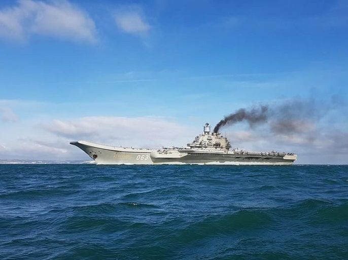 A handout photograph made available by Dover Marina.com on 21 October 2016 showing Russian aircraft carrier Admiral Kuznetsov with the White Cliffs of Dover in the background in the English Channel, 21 October 2016. The Russian Task Group, which includes the sole Russian aircraft carrier, Admiral Kuznetsov, the nuclear powered Kirov Class Battlecruiser, Pyotr Velikiy and two Udaloy Class Destroyers, Vice Admiral Kulakov and Severomorsk sailed from Russia on Saturday 15