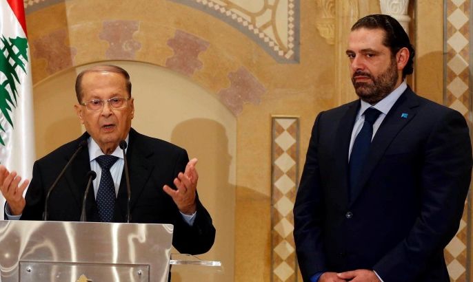 Christian politician and FPM founder Michel Aoun (L) talks during a news conference next to Lebanon's former prime minister Saad al-Hariri after he said he will back Aoun to become president in Beirut, Lebanon October 20, 2016. REUTERS/Mohamed Azakir