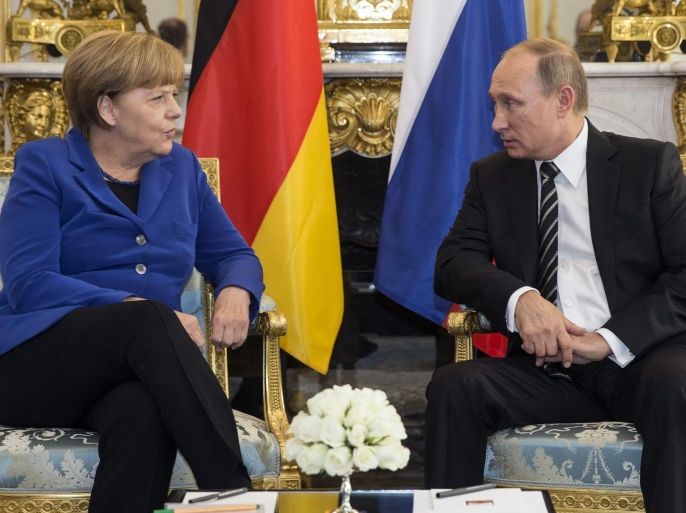 German Chancellor Angela Merkel (L) with Russian President Vladimir Putin during a bilateral prior to a summit on Ukraine at the Elysee Palace in Paris, France, 02 October 2015. German Chancellor Angela Merkel, Ukrainian President Petro Porochenko, French President Francois Hollande and Russian President Vladimir Putin take part of the summit. EPA/ETIENNE LAURENT / POOL MAXPPP OUT