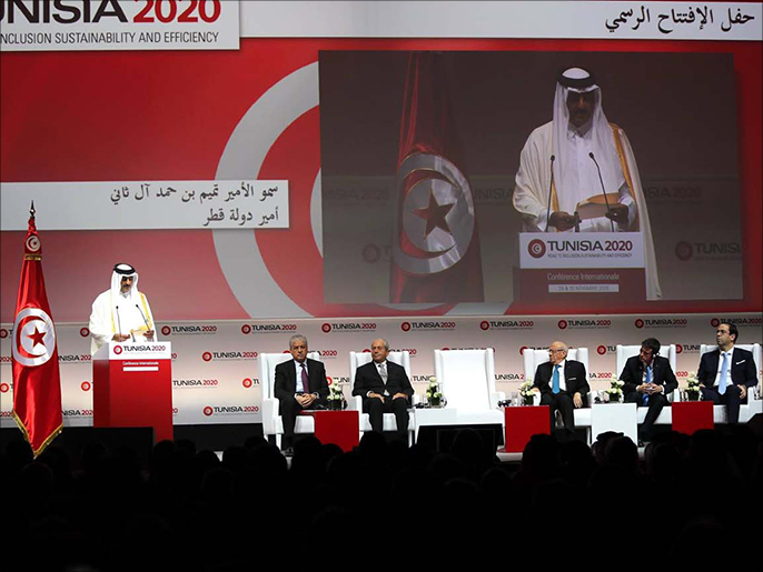 ‪أمير قطر الشيخ تميم بن حمد آل ثاني خلال إلقاء كلمته في المؤتمر‬ (الجزيرة)