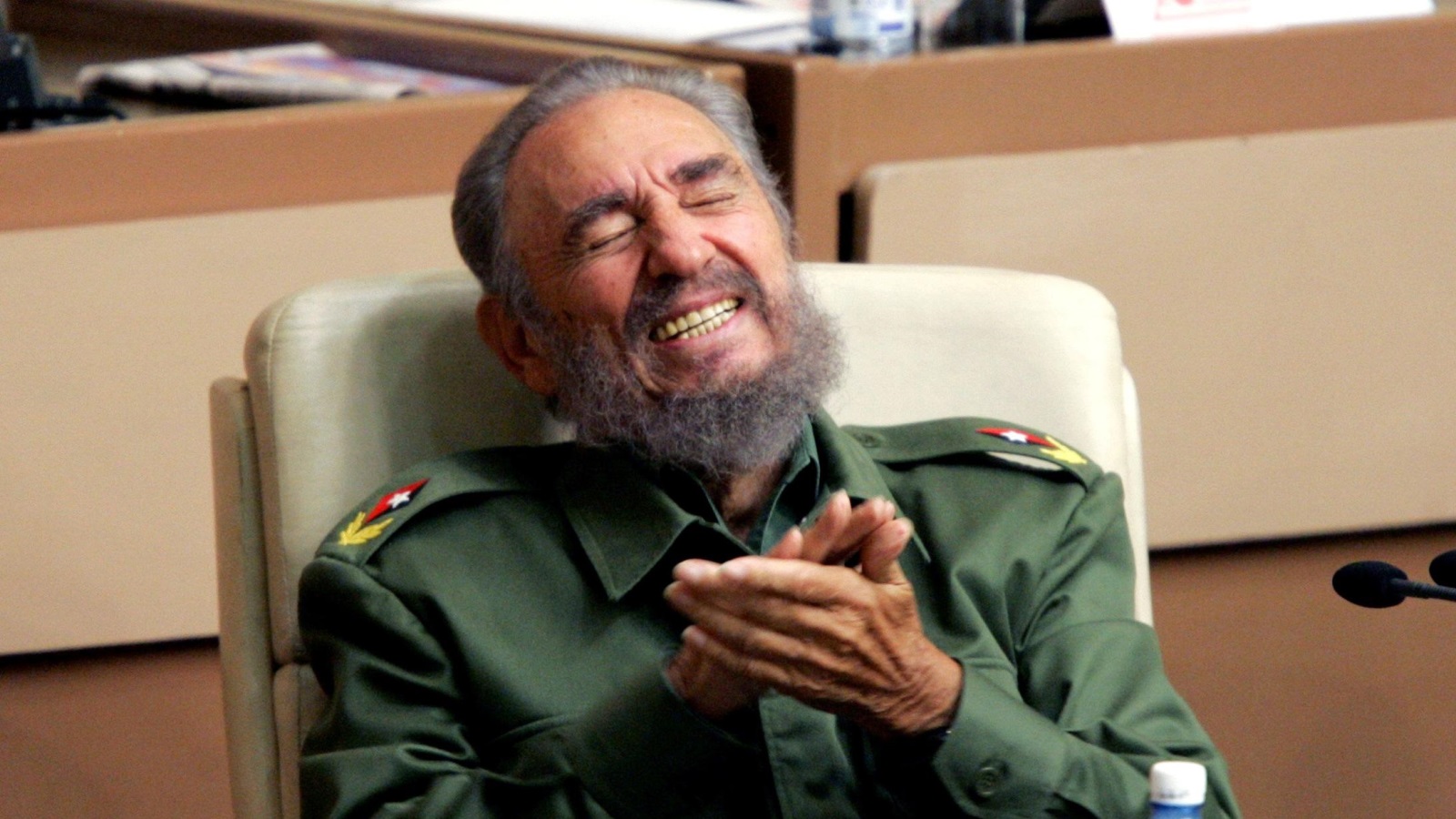 Then Cuban President Fidel Castro laughs during the year-end session of the Cuban parliament in Havana in this December 23, 2005 file photo. REUTERS/Claudia Daut/File Photo