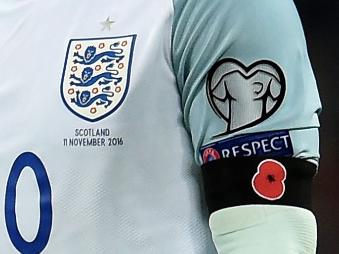 England's captain Wayne Rooney wears a black armband with a poppy during the FIFA World Cup 2018 Qualification group F match between England and Scotland at Wembley Stadium in London, Britain, 11 November 2016. Rooney and his England teammates wore black armbands featuring a remembrance poppy, despite a FIFA ban. The poppy is an artificial flower that is used to commemorate military personnel who have died in war.