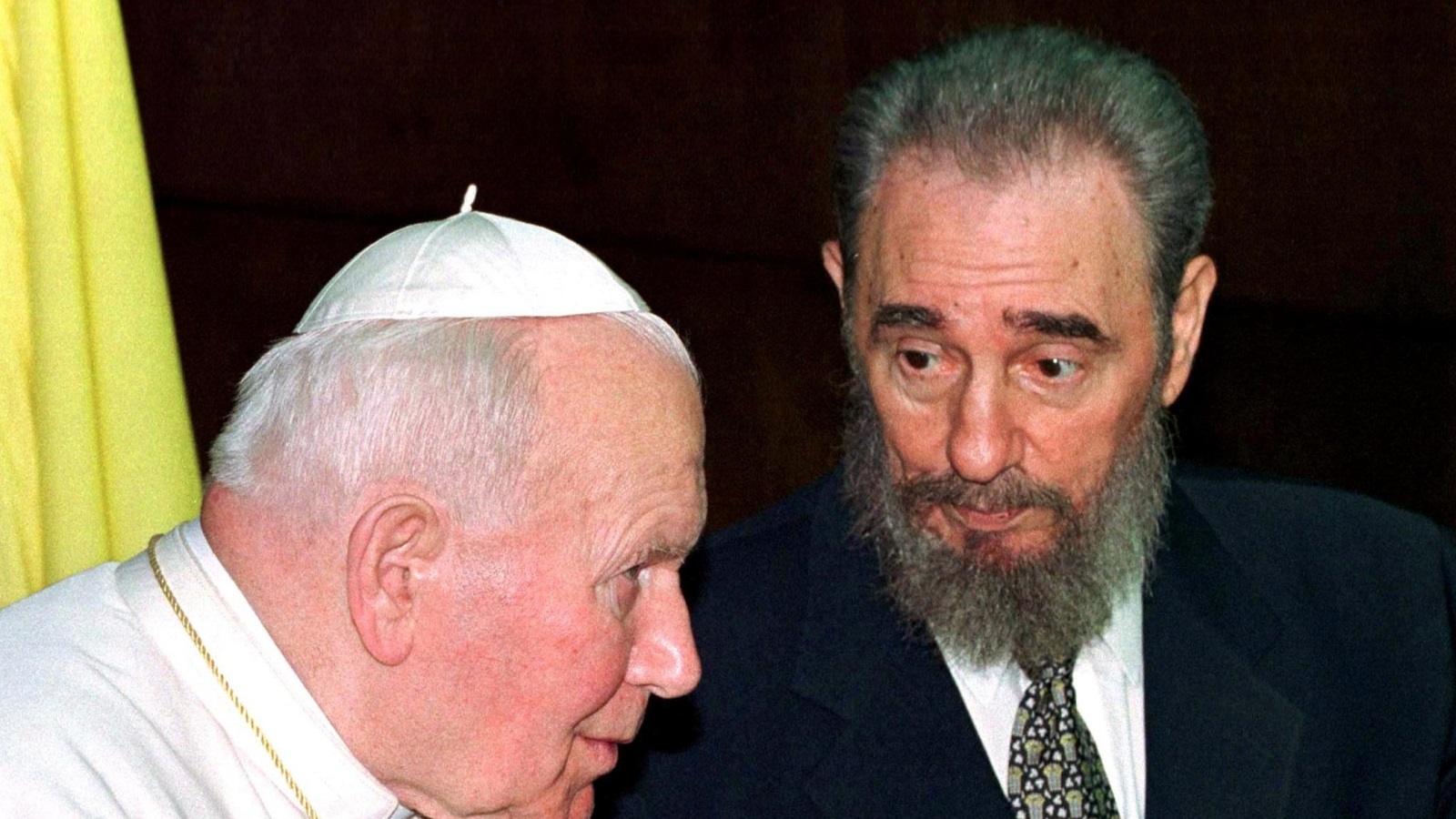 Then Cuban President Fidel Castro talks to then Pope John Paul II during the presentation of their delegations at the Palace of the Revolution in Havana in this January 22, 1998 file photo. REUTERS/Paul Hanna/File Photo