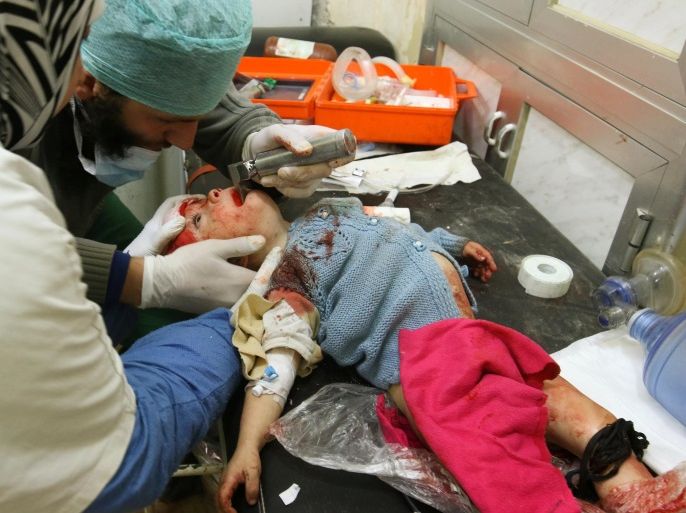 Medics treat an injured child inside a field hospital after airstrikes on the rebel held areas of Aleppo, Syria November 18, 2016. REUTERS/Abdalrhman Ismail ATTENTION EDITORS - VISUAL COVERAGE OF SCENES OF INJURY OR DEATH