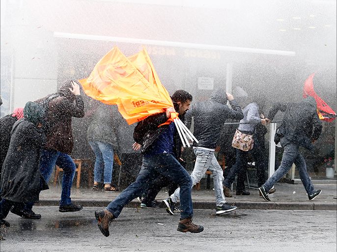 epaselect epa05618778 Turkish police uses a water cannon to disperse protestors during a rally against the arresting of lawmakers of the People's Democratic Party (HDP), in Istanbul, Turkey, 05 November 2016. The co-leaders of the pro-Kurdish and pro-minority political party Peoples' Democratic Party (HDP), Figen Yuksekdag and Selahattin Demirtas, had been detained on 04 November, along with at least nine other members of parliament (MPs), as part of a counter-terrorism investigation following a police raid in the HDP party headquarters. The HDP is accused by the Turkish government to have links with the Kurdistan Workers' Party (PKK) militant group, an accusation HDP strongly denies. EPA/SEDAT SUNA