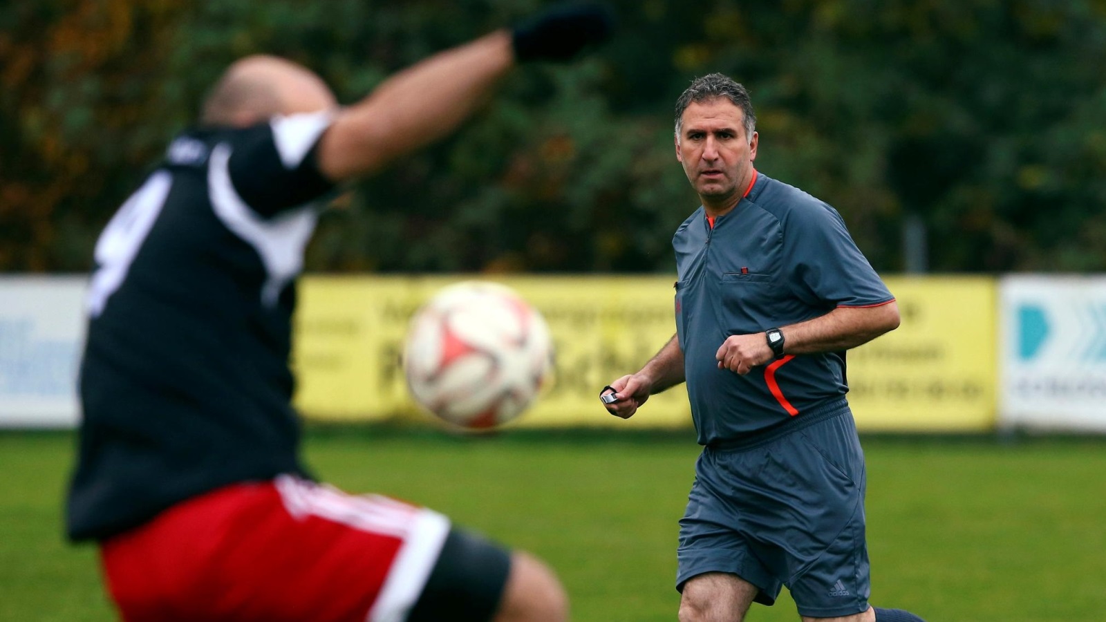 Former FIFA referee Hamdi Al Kadri conducts a German 9th division soccer match between TSV Pyrbaum and FC Altdorf in Pyrbaum, southern Germany, November 6, 2016. Picture taken November 6, 2016. Syrian migrant Al-Kadri was member of the referee team at high level FIFA matches, such as World Cup bouts  before he came to Germany as a Syrian refugee. REUTERS/Michael Dalder