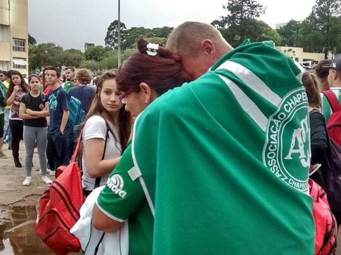 A handout picture made available by Diario do Iguacu shows supporters of the Chapcoense FC gathering at the club in Chapeco, Brazil, on 29 November 2016. A total of 76 people died when an aircraft crashed late 28 November 2016 with 81 people on board. A plane reportedly carrying 81 people, including the players of the Brazilian soccer club Chapecoense, crashed in a mountainous area outside Medellin as it was approaching the Jose Maria Cordoba airport. The cause of the i