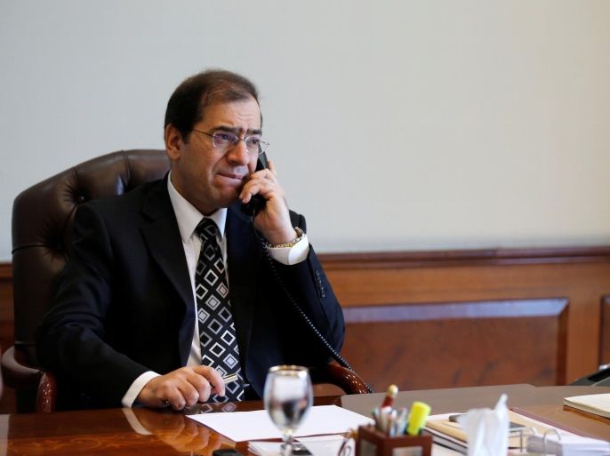 Tarek El Molla, Egypt's Minister of Petroleum and Mineral Resources, speaks on the telephone during an interview with Reuters at his office in Cairo, Egypt, October 29, 2015. Picture taken October 29, 2015. REUTERS/Amr Abdallah Dalsh