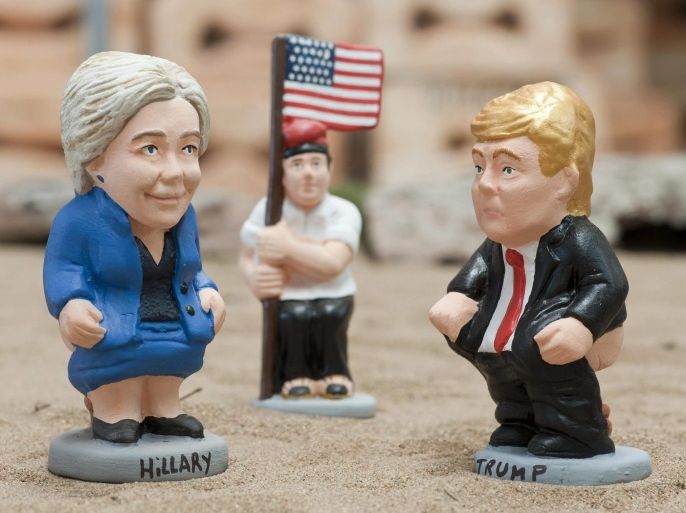 Two traditional Christmas little sculptures called 'caganers' (lit. defecators) picturing US presidential candidates Hillary Clinton (L) and Donald Trump (R) were launched by the brand caganer.com in the town of Torroella de Montgri, Catalonia, northeastern Spain, 04 November 2016. The 'caganer' is a traditional figure in Catalonian nativity scenes.