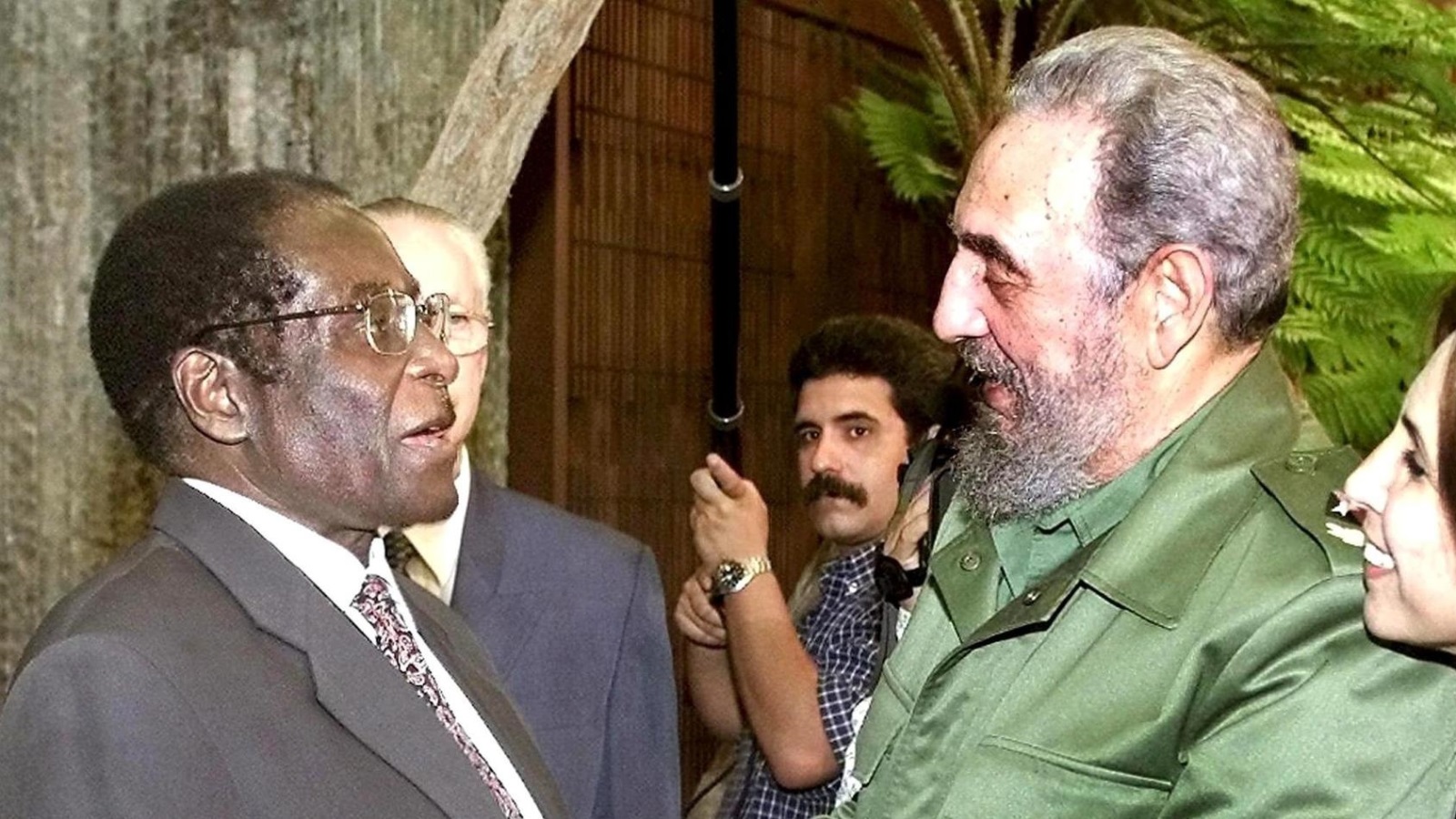 (FILE) A file picture dated 16 July 2002 of Zimbabwe's President Robert Mugabe (L) welcomed by Cuban leader Fidel Castro at the Revolution Palace in Havana, Cuba. According to a Cuban state TV broadcast, Cuban former President Fidel Castro has died at the age of 90 on 25 November 2016.