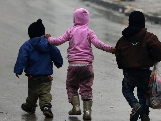 Children walk together as they flee deeper into the remaining rebel-held areas of Aleppo, Syria December 13, 2016. REUTERS/Abdalrhman Ismail TPX IMAGES OF THE DAY